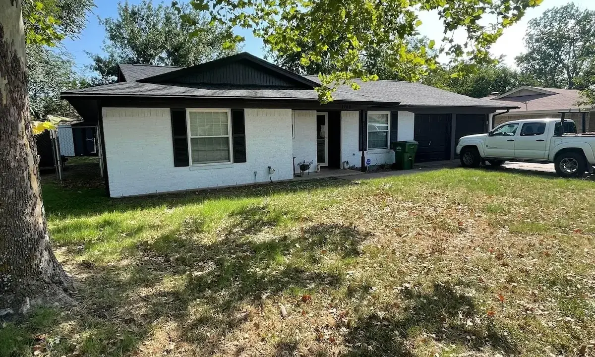 Professional roofing crew working on a residential roof in Powell